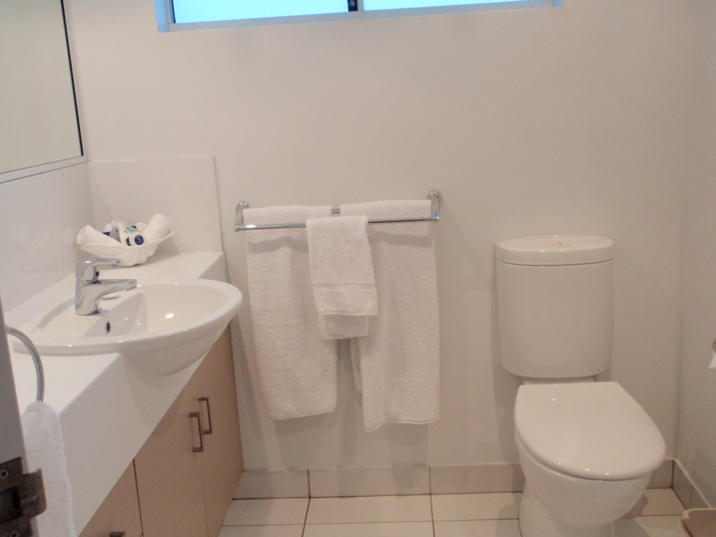 Sparkling clean white bathroom after post-renovation cleaning